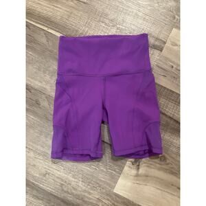 Purple Lululemon biker shorts with see through sides size 2